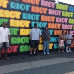 Participants pose in front of Coney Island Art Walls