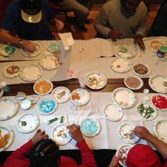 Participants decorating holiday cookies.