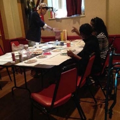 Participants decorating holiday cookies.