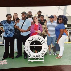 Participants pose with Spirit Cruises life preserver circle.
