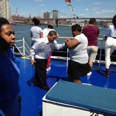 Participants dancing on deck of Spirit Cruises.