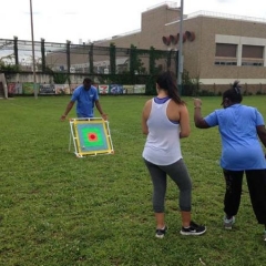 A participant mid-swing trying to git the bullseye target.