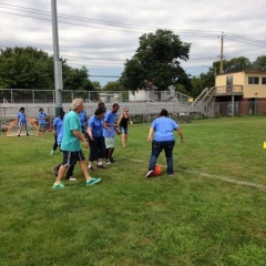 Participants involved in a game of soccer with Respite Director, Mitch Goldstein in the middle of the action.