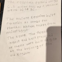 A paper describing pyramids and tombs is written by participants.