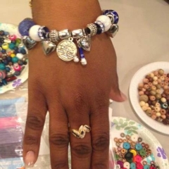 A newly made bracelet on a particpant wrist.