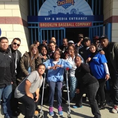Participants pose in front of Cyclones VIP and Media Entrance.