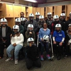 Group of participants posing in team helmets.