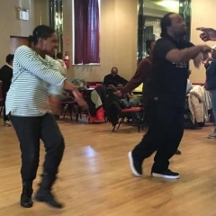 Participants following the dance instructor.