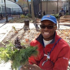 A participant holding up a plant.