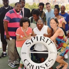Participants pose with Spirit Cruises life saver.