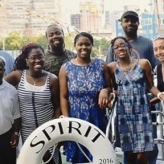 Participants pose in on board of the cruise.