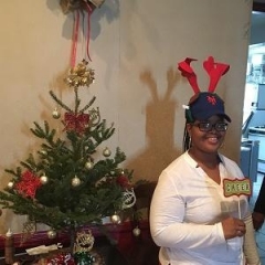 Participant holding up holiday props.
