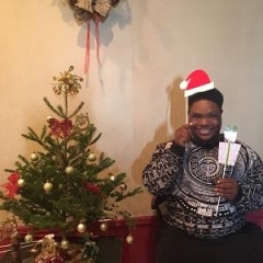 Participant holding up holiday props.
