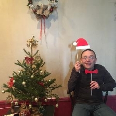 Participant holding up holiday props.
