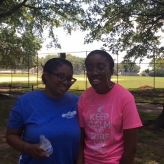 A participant takes a picture with a staff member.
