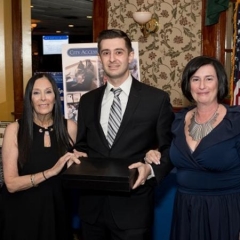 Eric Rosen, event honoree, stands in the center with his mom, Ilene Rosen, on the left and Sophia Rossovsky on the rights.
