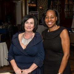 Sophia Rossovsky, City Access Executive Director on the left and Sheila Green-Gholson on the right.  ID: Sophia and Sheila are wearing a deep-blue and black gowns, respectively.