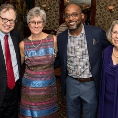 Left to right: Andy Fisher, Susan Lofranco, Christopher Sims, Patsy Taylor.  ID: The group smiles for the camera.