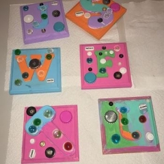 Participants use their first name initials as centerpieces for their artwork.