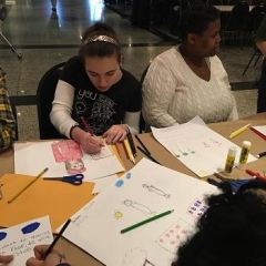 A participant concentrating on her drawing.