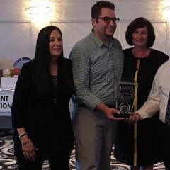 Frank Wilkinson being presented an award for his dedication to people with developmental disabilities.