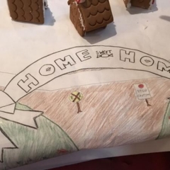 A table cloth made by participants.  ID:  The cloth reads "Home Sweet Home".