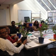 Participants pose with plants.