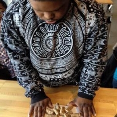 A participant making a Cork Hot Pad.