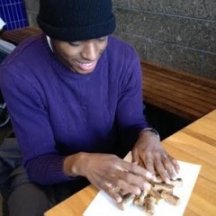 A participant making a Cork Hot Pad.