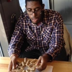 Participant making a Cork Hot Pad.