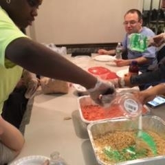 Participants learning to make rice crispy treats.