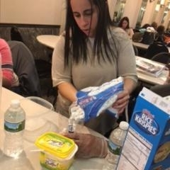 Participants learning to make rice crispy treats.