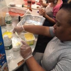 Participants learning to make rice crispy treats.