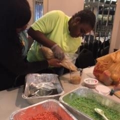 Participants learning to make rice crispy treats.