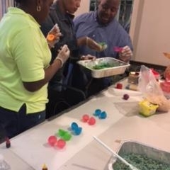 Participants learning to make rice crispy treats.
