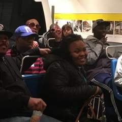 The group participates in a discussion at the Transit Museum.