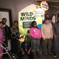 Participants pose in front of Wild Animals exhibit.