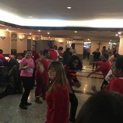 Participants dancing at a Valentine's Day party.