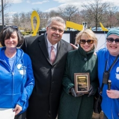 Lois and Richard Nicotra receive an award for their generous contributions and support.  ID: Mr. and Ms. Nicotra pose for a picture with Sophia Rossovsky and Holly Bonner.