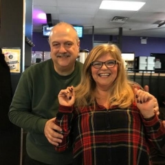Fran Farin, DayHab Coordinator, and her husband smile for the camera.  ID: Fran stands next to her husband.