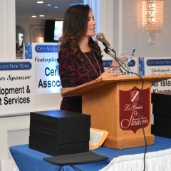 Steven Matteo representative accepting an award on his behalf