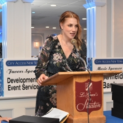 Aileen Chumard Fuchs accepting an award