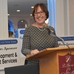 Helene Toron accepts an award