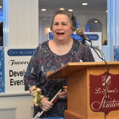 Ellen Rubin accepts an award.