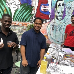 Participants enjoy refreshments in the colorful yard of The Living Gallery.