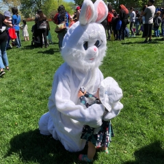 Easter Bunny hugs little girl at the Staten Island Snug Harbor Cultural Center & Botanical Gardens.