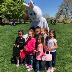 A group of kids pose for a picture with the Easter Bunny.