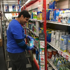 Participant restocking shelves at Staples, as part of City Access New York Vocation program.