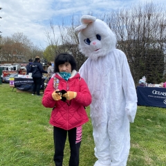 Participant posing with an Easter Bunny