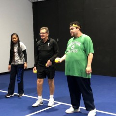 XPO’s instructor teaches participants how to properly toss their ball to their partner and how to receive it.